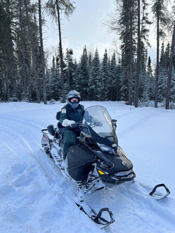 staff on snowmobile