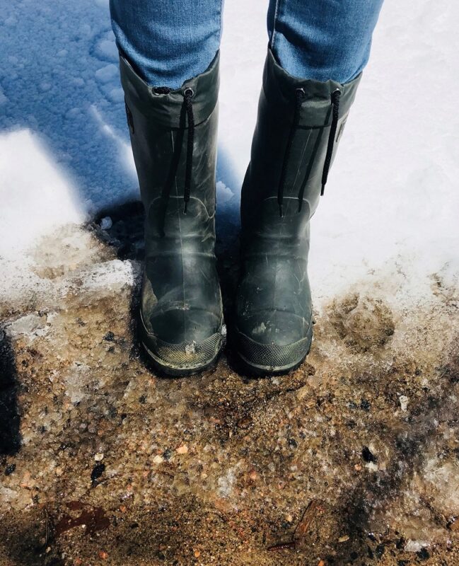 Mud boots in the mud and snow.