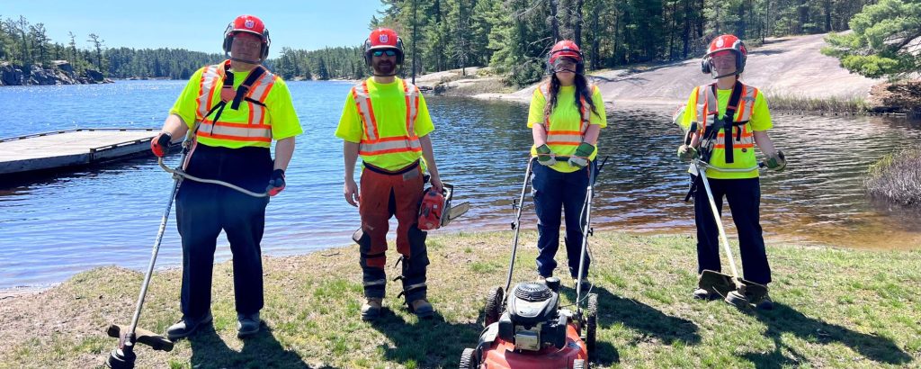maintenance staff in high vis, holding power tools