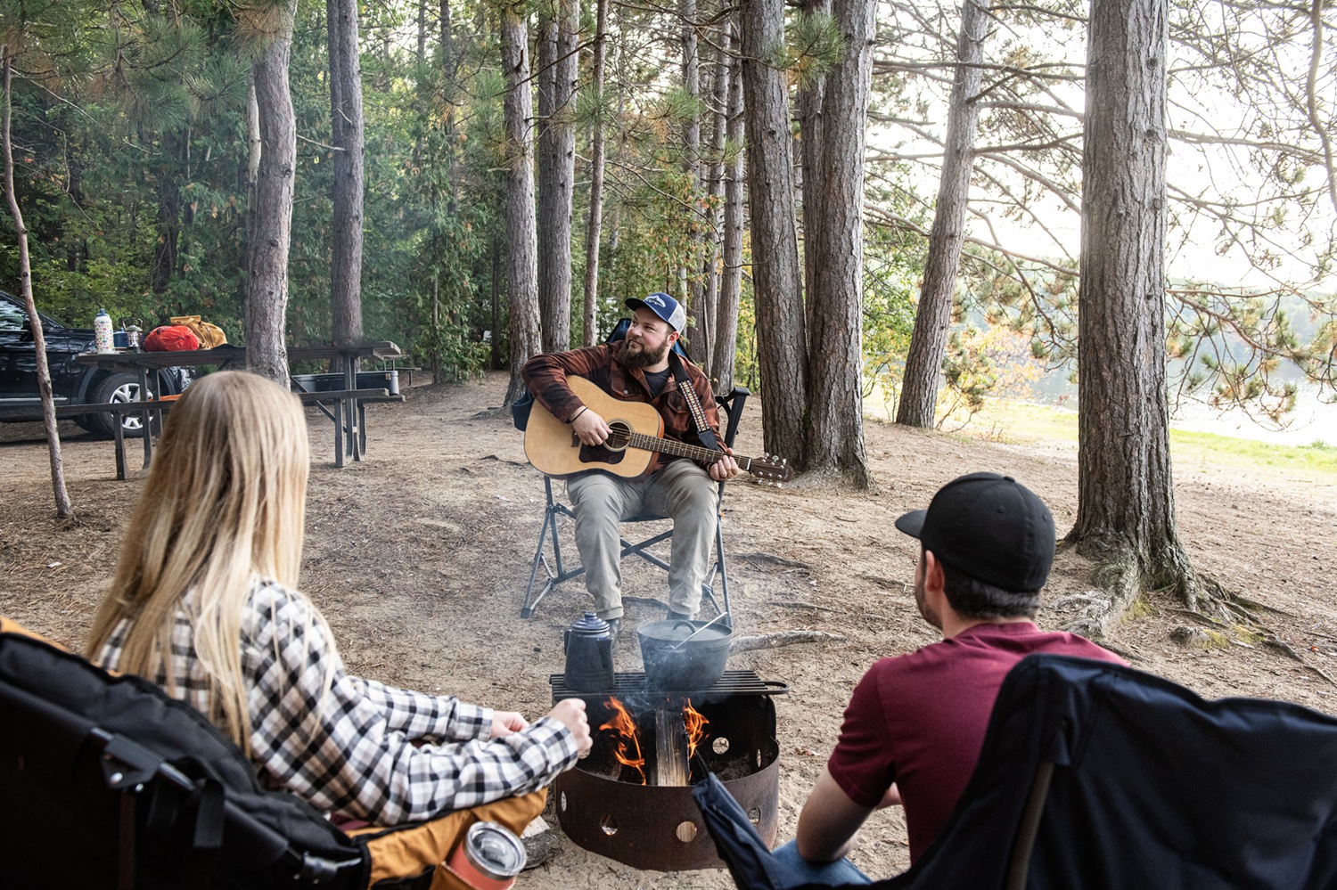 group sitting around campfire
