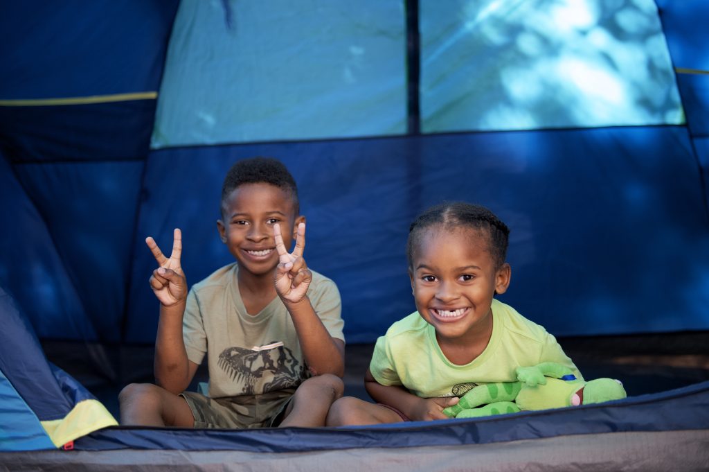 two children inside of tent