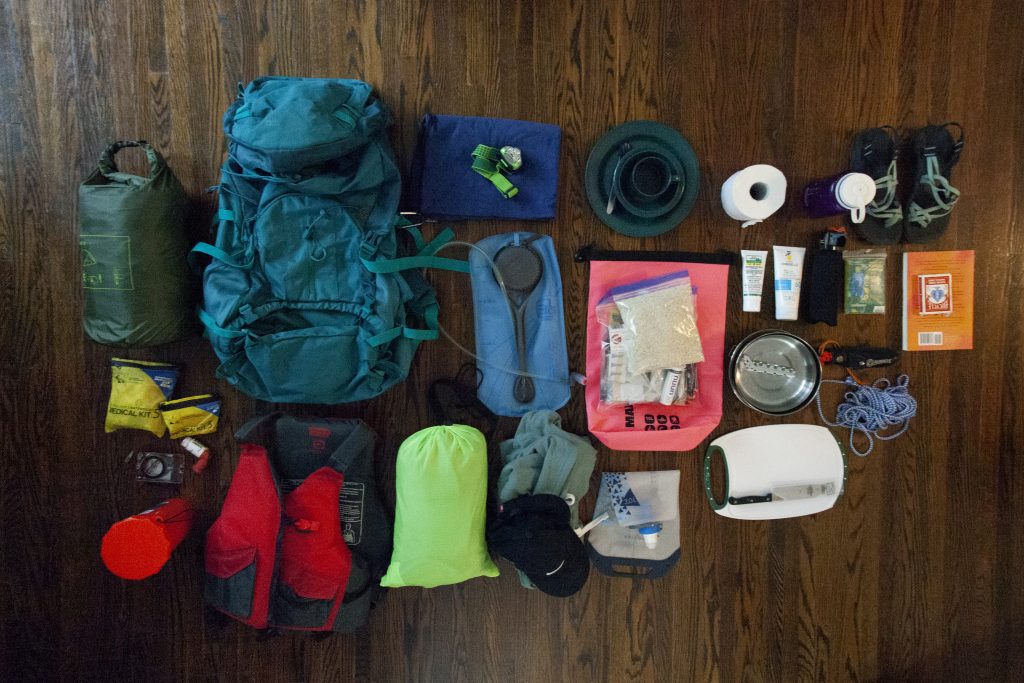 flat lay of backcountry packing items