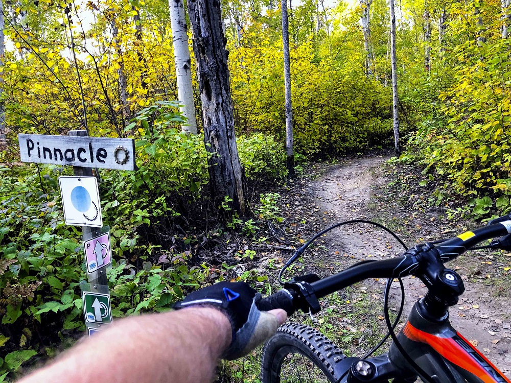 view of biker on trail