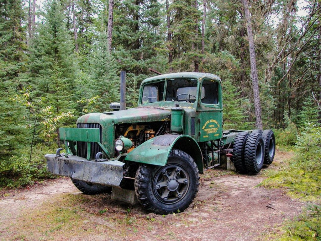 old logging truck in forest