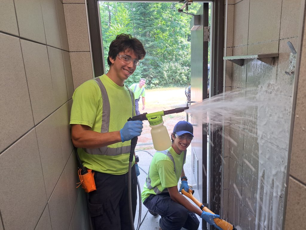 Adam and Anthony cleaning park shower