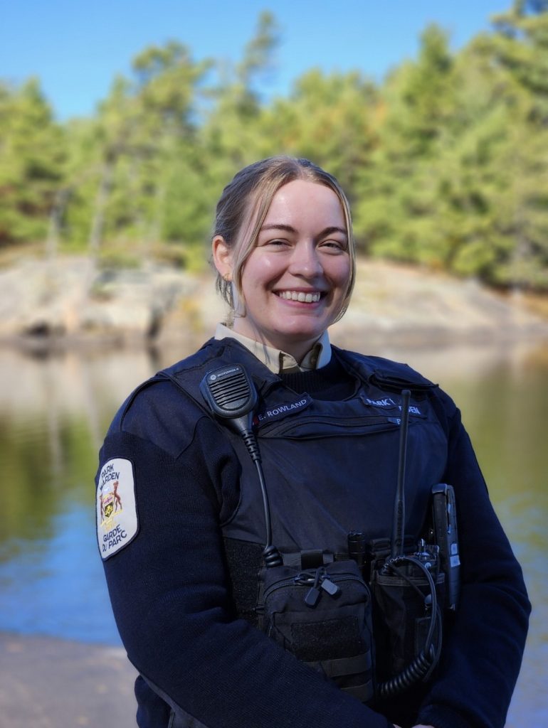 Erin standing in front of body of water