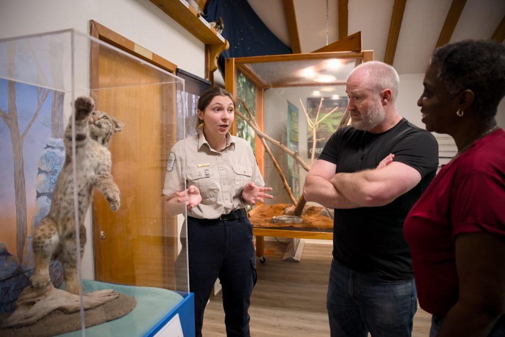 Discovery staff talking to visitors about an exhibit