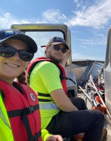 two staff on boat