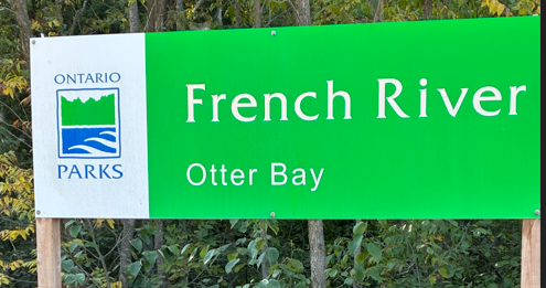 Park sign reading "French River Otter Bay"