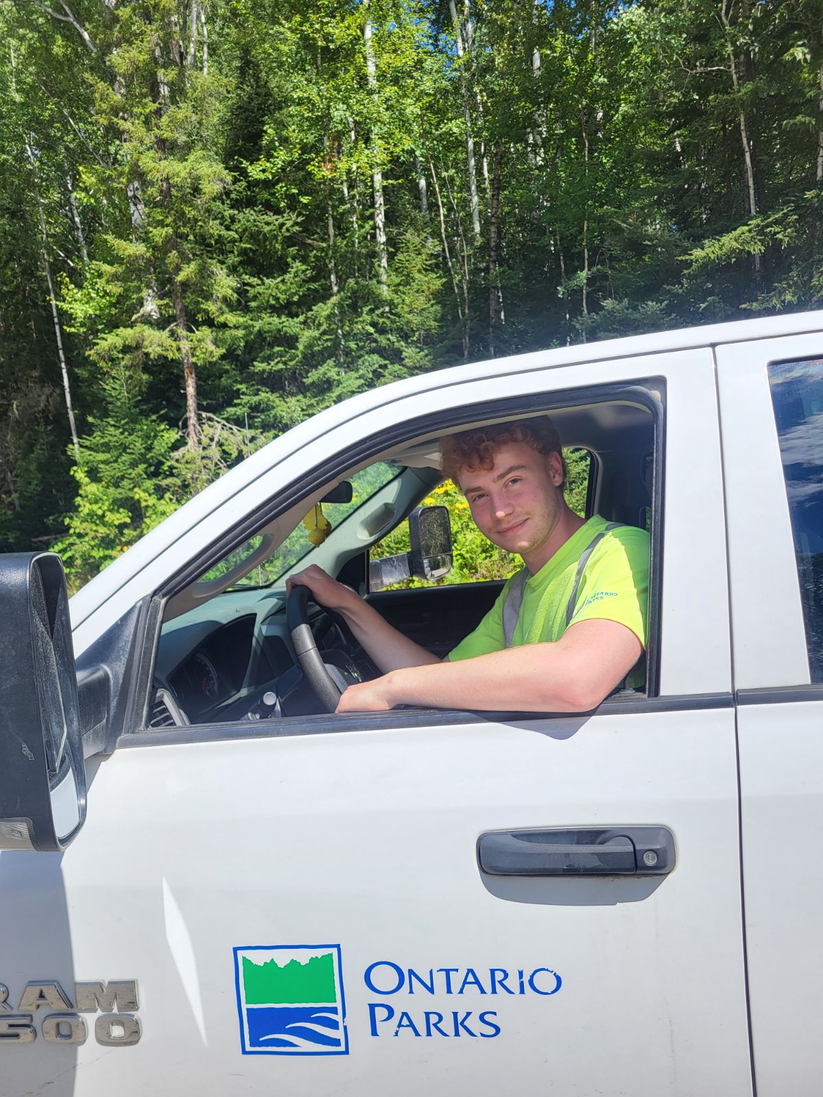 staff sitting in park vehicle