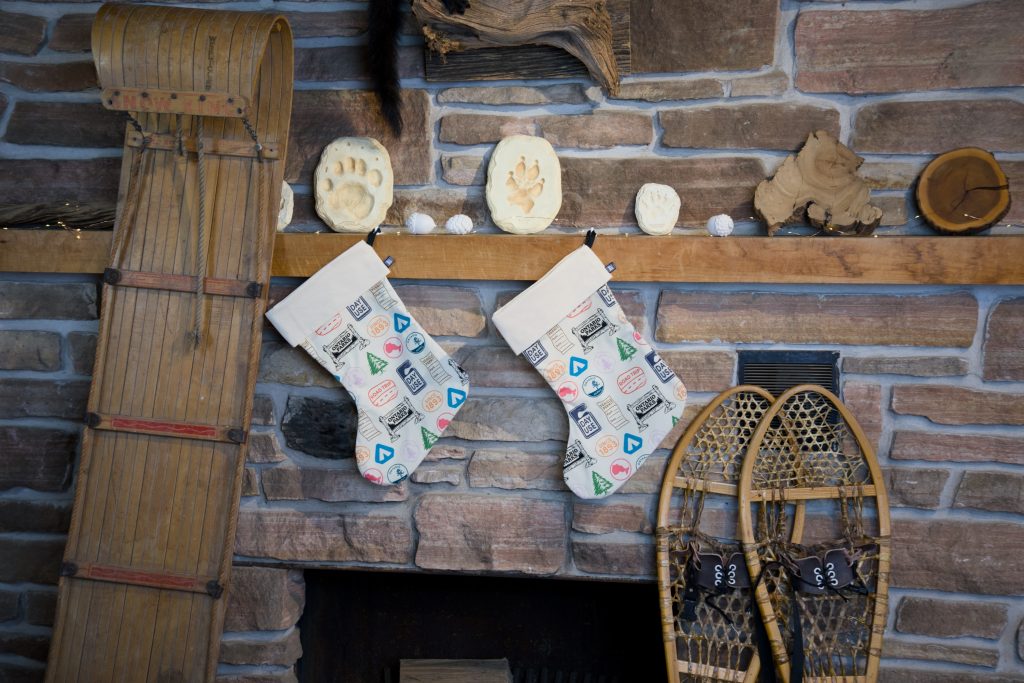 Ontario Parks holiday stockings hanging off a mantle. 