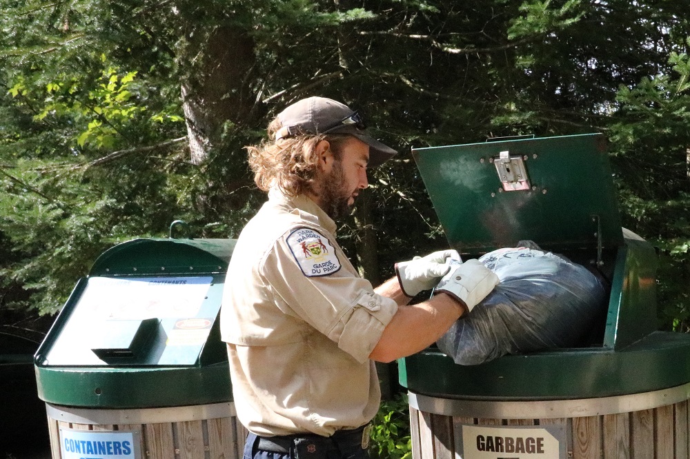 staff throwing out garbage