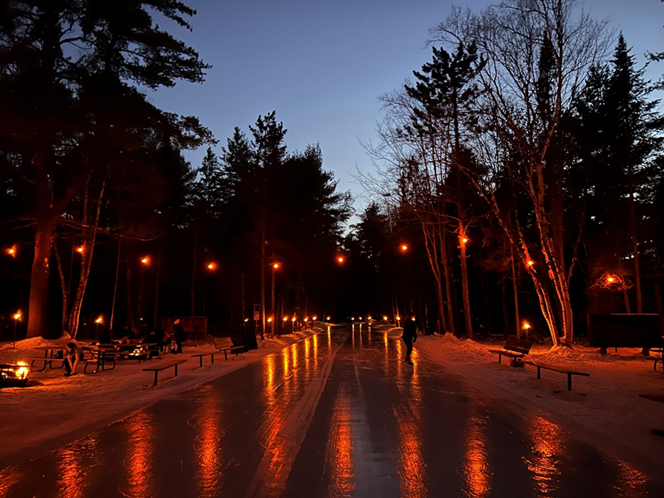 lanterns strung across ice trail at night