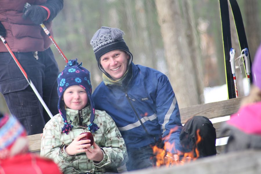 father and son around campfire