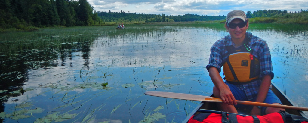 Trevor in a canoe on a lake