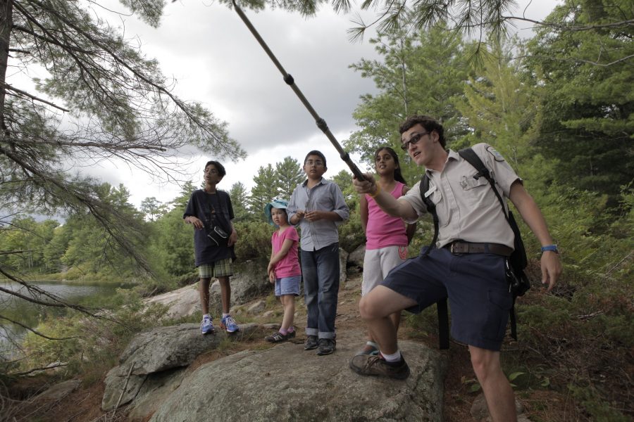 NHE leader on guided hike at Six Mile Lake