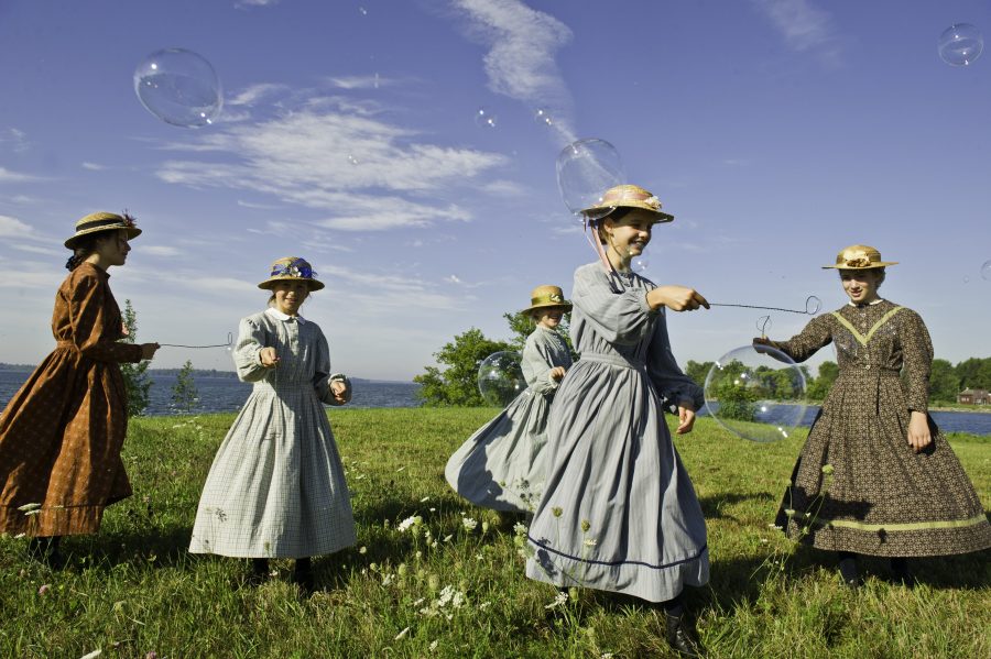 women in pioneer costumes