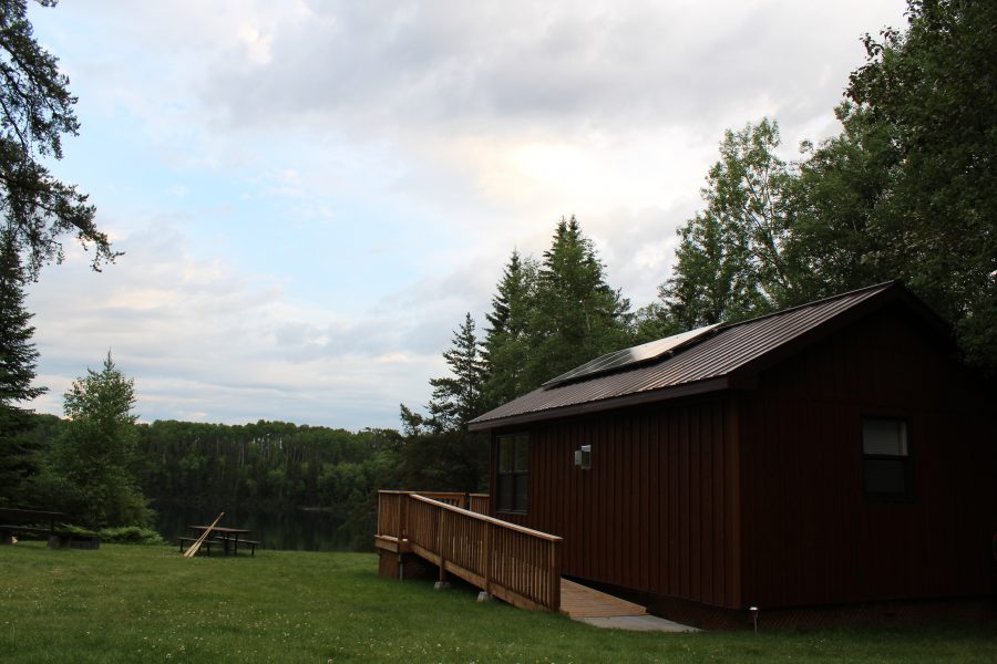 cabin overlooking lake at twilight