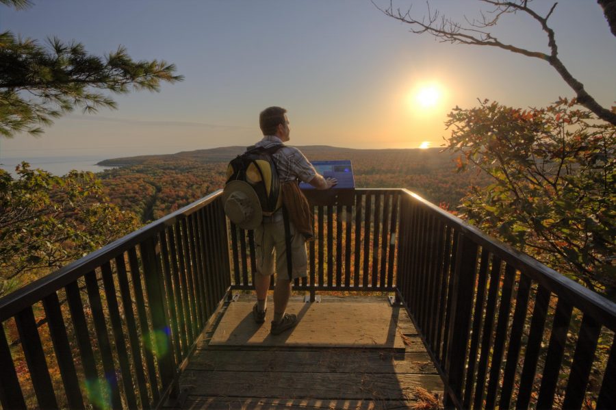 hiker standing on lookout platform