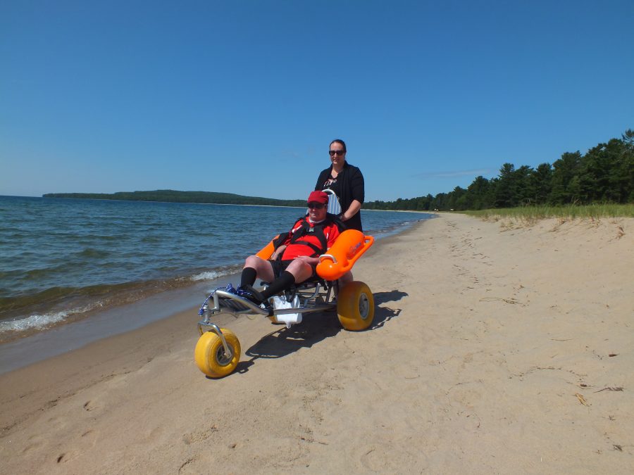 wheelchair with front wheel and buoyancy arms