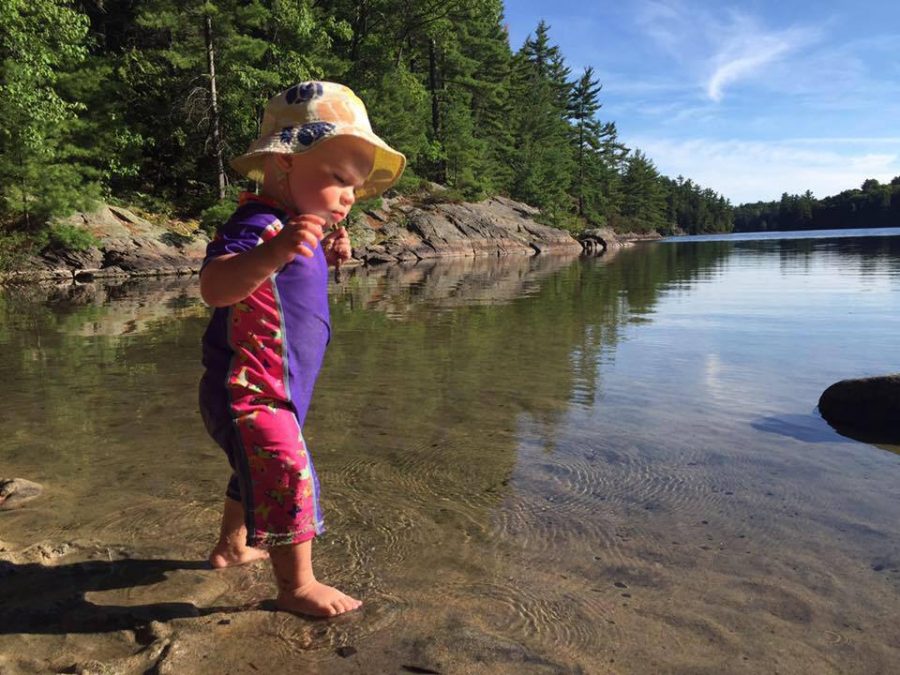 Baby plays on a beach