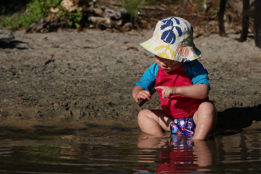 Baby plays in the water