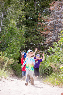 Children running out of forest 