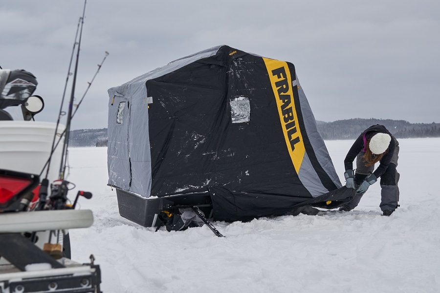 Setting up ice fishing shelter