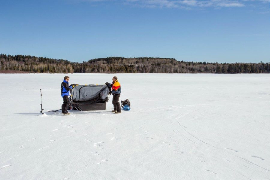 Setting up the ice fishing shelter