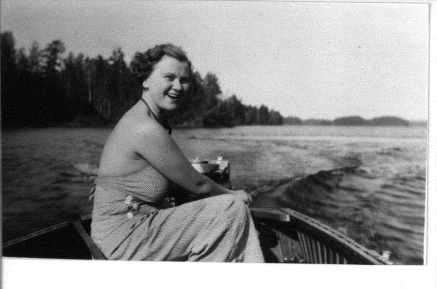 Black and white photo of Kay in a boat