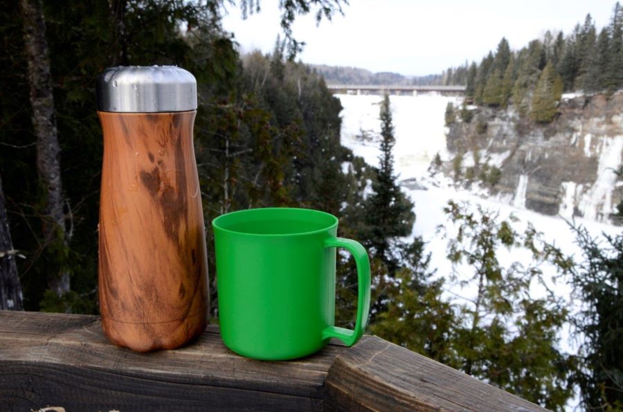 Mug and tea with falls in the back