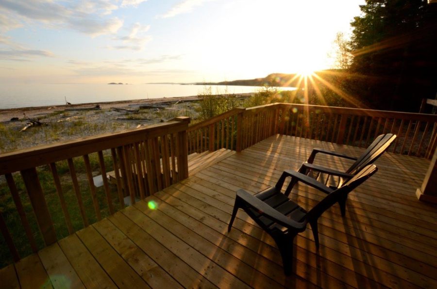 chairs on porch by lake