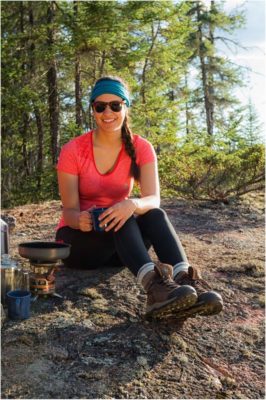 Woman sits with mug next to her