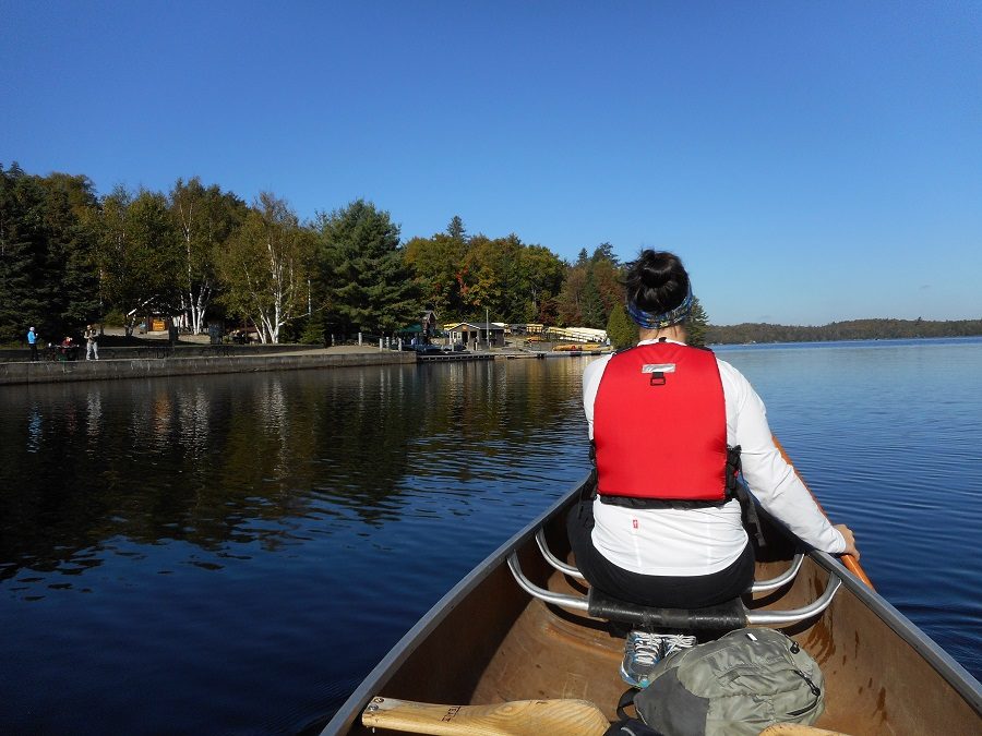 Woman paddling canoe