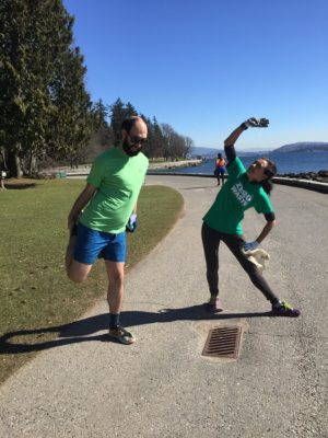 Two joggers stretch