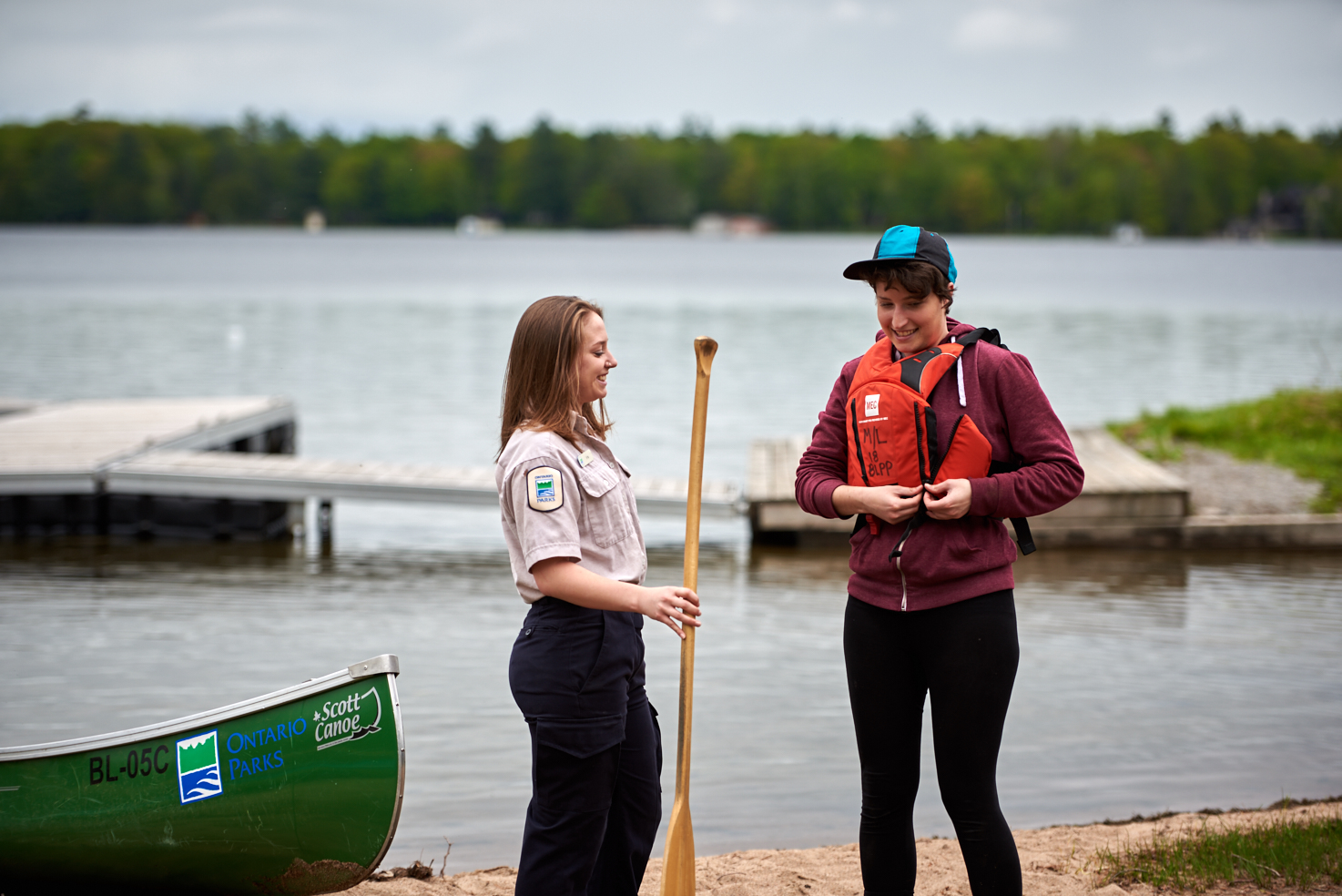 Staff helping paddler,