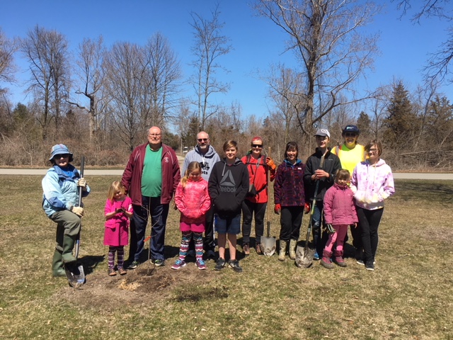 Group of 11 people on a sunny spring day posing for the camera