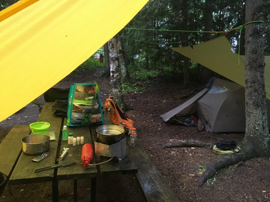 campsite with tent and tarps