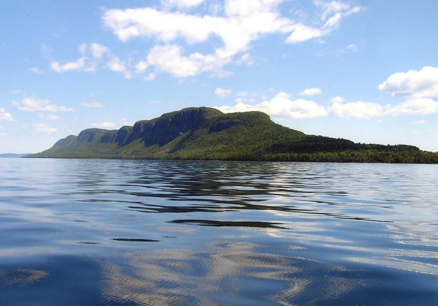 Long, treed, hilly peninsula from the lake