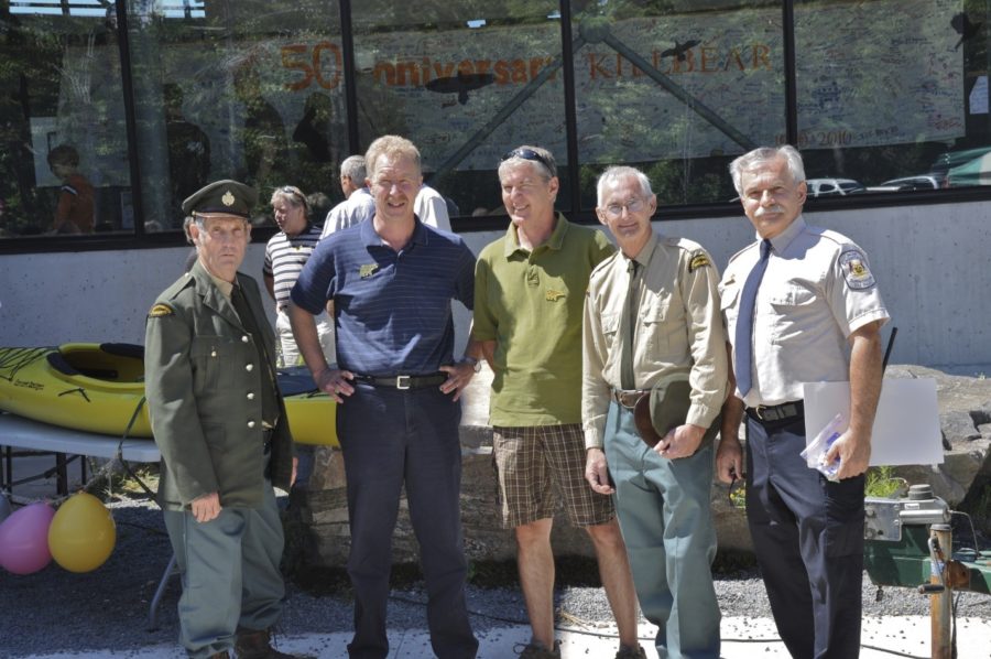 Group of five gentlemen posing for the picture on a sunny day