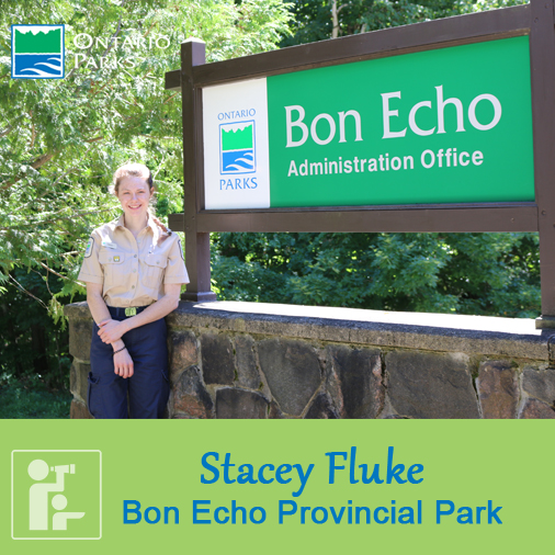 ranger standing in front of sign