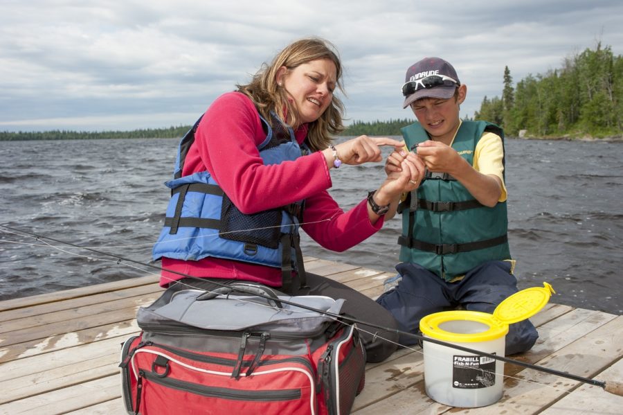 mom showing bait to son