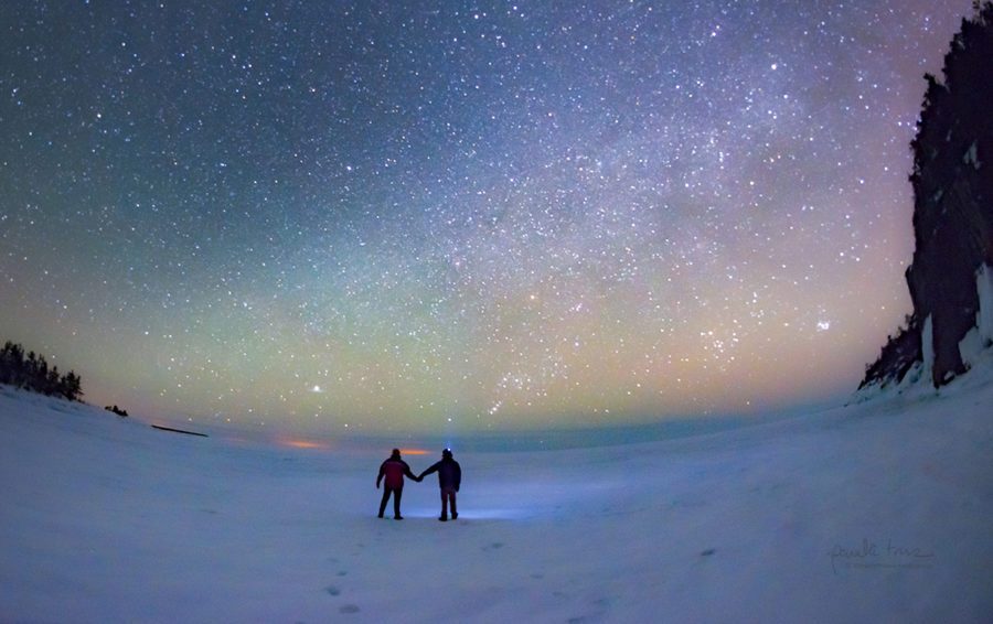 people looking at stars in winter