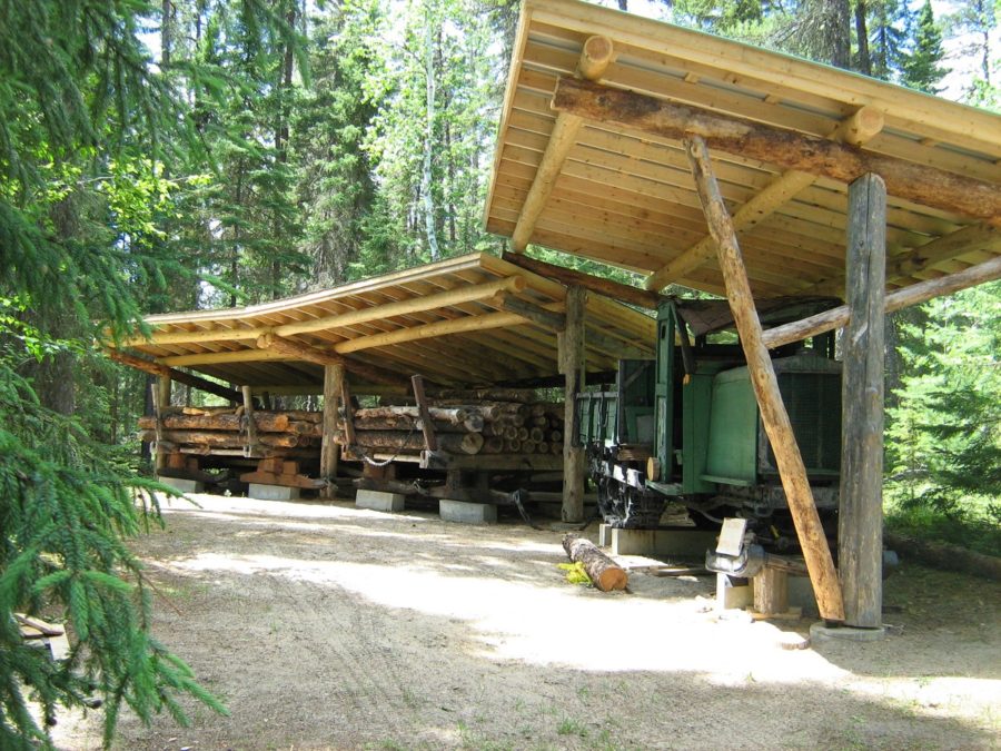 Wooden structure built over old tractor meant to be hauling logs