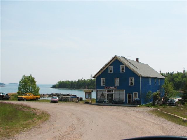 Blue three story building on a shore