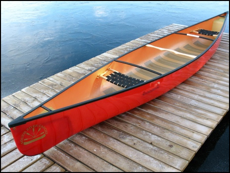 Red canoe on a dock