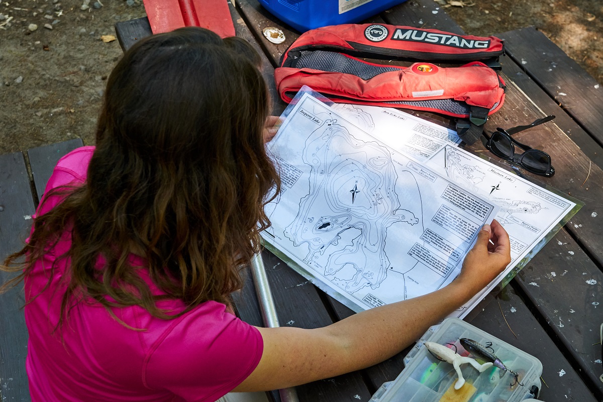 Woman from behind looking at a map 