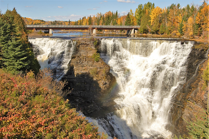 Waterfall with fall leaves on trees