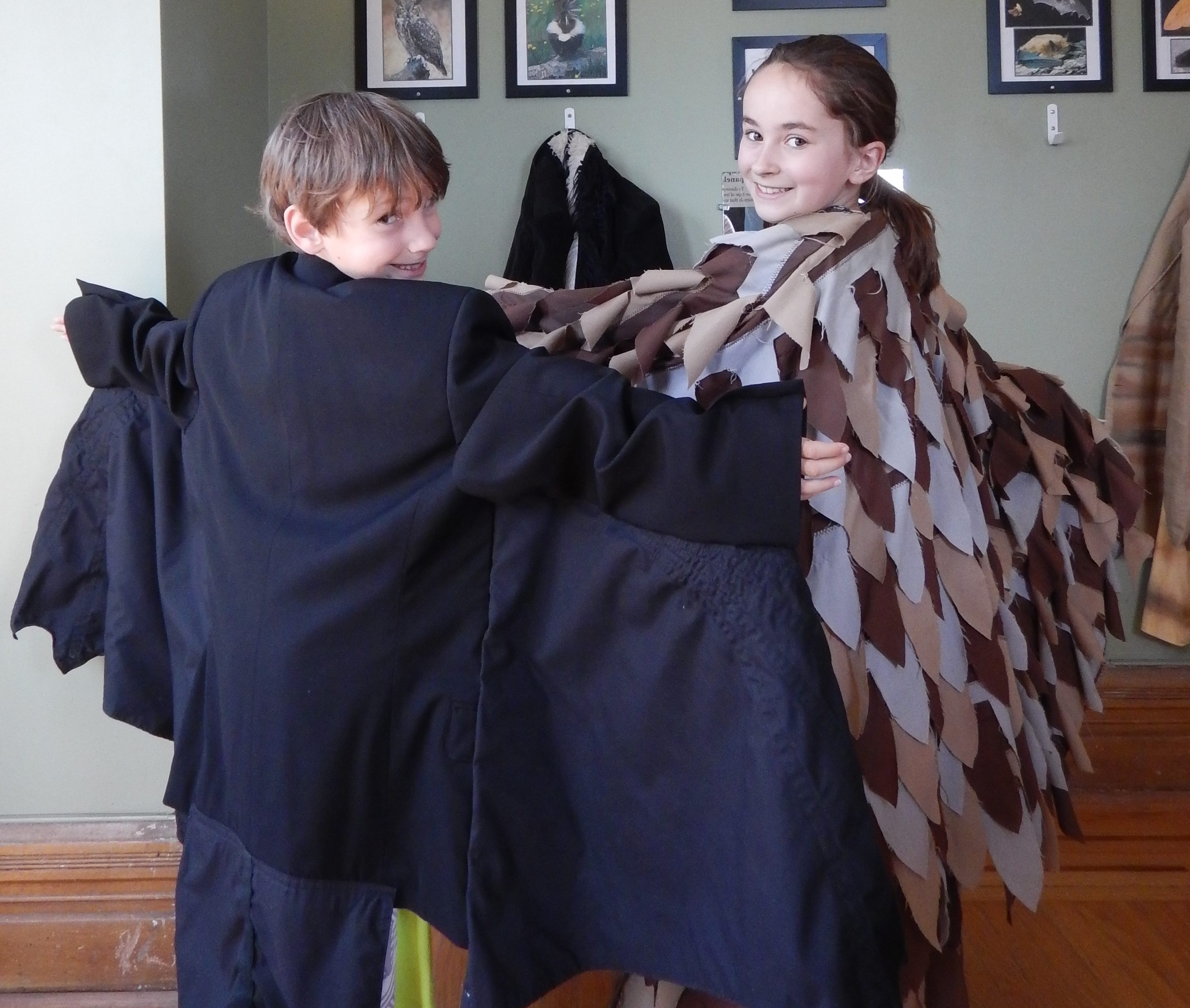 Two children in winged costumes