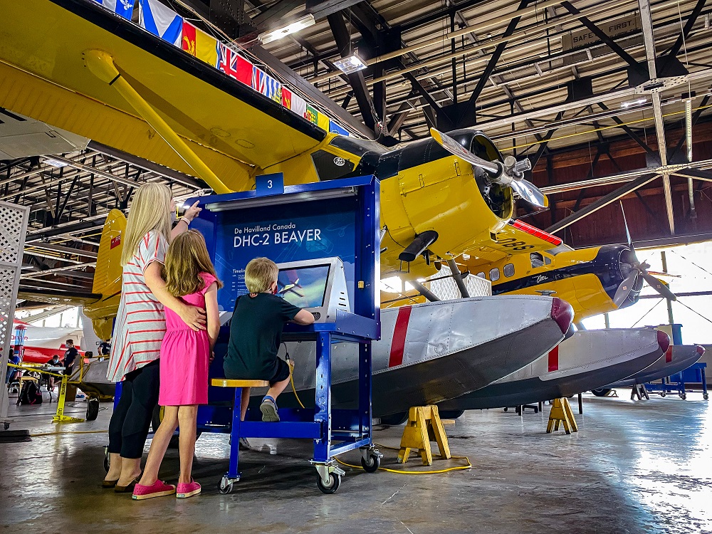 family looking at plane